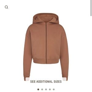 Skims outdoor zip hoodie in the color tiger eye